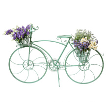 modelo de bicicleta country com cesto de flores no chão